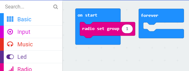 MakeCode workspace showing the “radio set group” block in the “on start” block
